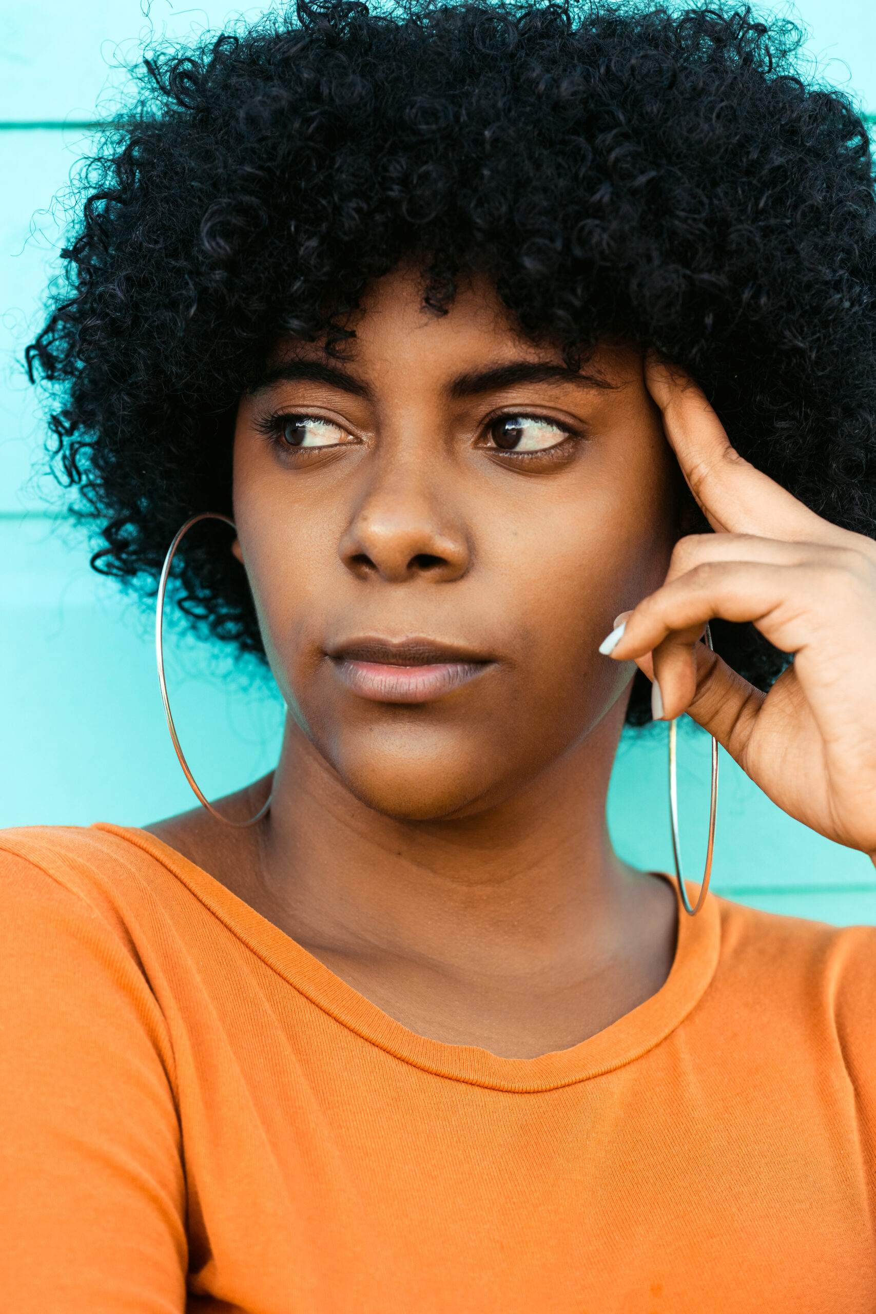A vertical shot of a young attractive Afro-American lady